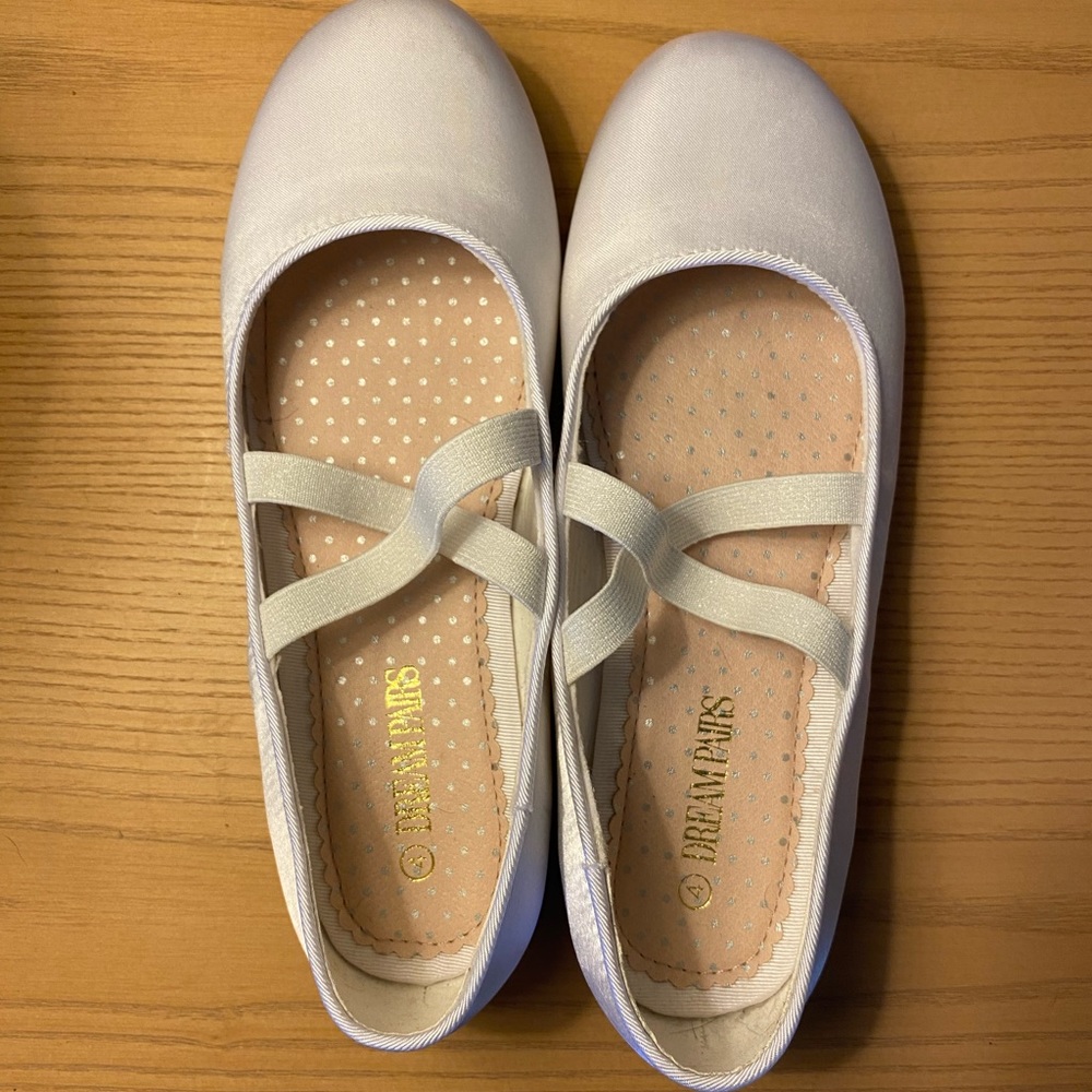 Girls white satin shoes.